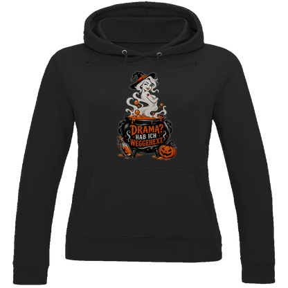 JA Fluch Queen – Damen-Hoodie in Tiefschwarz, Vorderansicht, Frontdruck: Hexe aus dem Hexenkessel mit Spruch „Drama? Hab ich weggehext.“