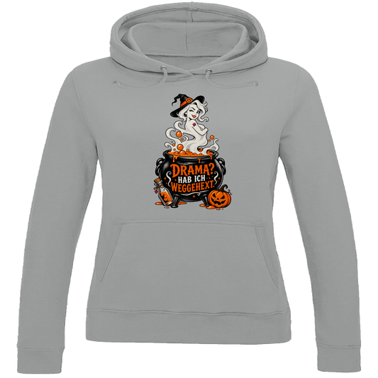 JA Fluch Queen – Damen-Hoodie in Grau meliert, Vorderansicht, Frontdruck: Hexe aus dem Hexenkessel mit Spruch „Drama? Hab ich weggehext.“