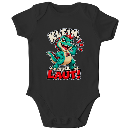 JA Jano Klein aber laut – Baby-Body in Schwarz, Vorderansicht, Frontdruck: Jano, der JA-Dino: „Klein, aber laut!“ – Kindermotiv mit großer Klappe