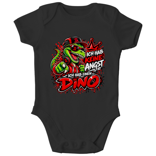 JA Ich habe keine Angst – Baby-Body in Schwarz, Vorderansicht, Frontdruck: Mutmacher-Dino: „Ich hab keine Angst. Ich hab einen Dino.“