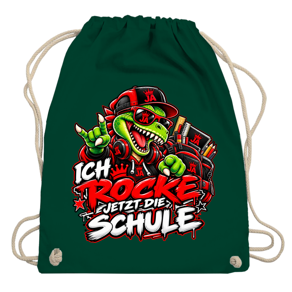 JA Schulstart Dino – Turnbeutel in Flaschengrün, Aufdruck: Dino mit Cap und Schulsachen: „Ich rocke jetzt die Schule“ zur Einschulung
