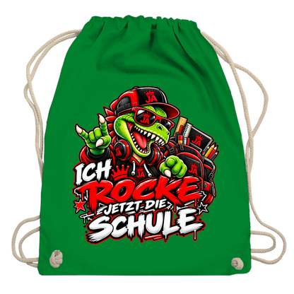 JA Schulstart Dino – Turnbeutel in Kellygrün, Aufdruck: Dino mit Cap und Schulsachen: „Ich rocke jetzt die Schule“ zur Einschulung