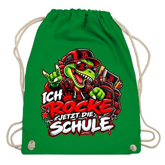 JA Schulstart Dino – Turnbeutel in Kellygrün, Aufdruck: Dino mit Cap und Schulsachen: „Ich rocke jetzt die Schule“ zur Einschulung