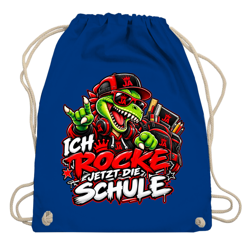 JA Schulstart Dino – Turnbeutel in Königsblau, Aufdruck: Dino mit Cap und Schulsachen: „Ich rocke jetzt die Schule“ zur Einschulung