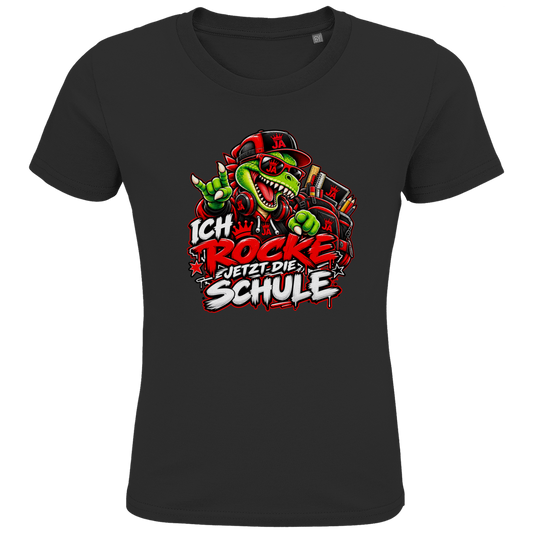 JA Schulstart Dino – Kinder-T-Shirt in Schwarz, Vorderansicht, Frontdruck: Dino mit Cap und Schulsachen: „Ich rocke jetzt die Schule“ zur Einschulung