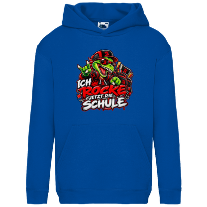 JA Schulstart Dino – Kinder-Hoodie in Royalblau, Vorderansicht, Frontdruck: Dino mit Cap und Schulsachen: „Ich rocke jetzt die Schule“ zur Einschulung