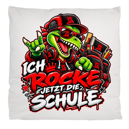 JA Schulstart Dino – Flauschkissen in Cremeweiß, Aufdruck: Dino mit Cap und Schulsachen: „Ich rocke jetzt die Schule“ zur Einschulung