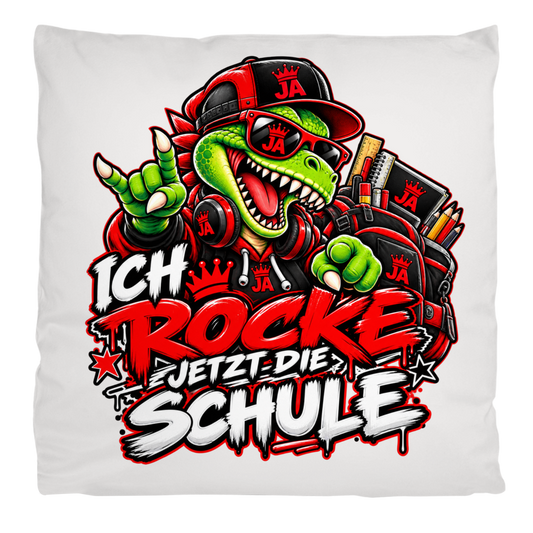 JA Schulstart Dino – Flauschkissen in Cremeweiß, Aufdruck: Dino mit Cap und Schulsachen: „Ich rocke jetzt die Schule“ zur Einschulung