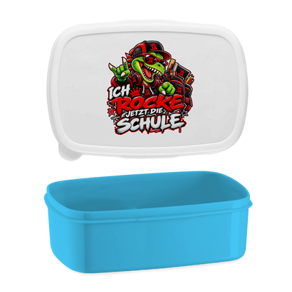 JA Schulstart Dino – Lunchbox in Blau, Aufdruck: Dino mit Cap und Schulsachen: „Ich rocke jetzt die Schule“ zur Einschulung