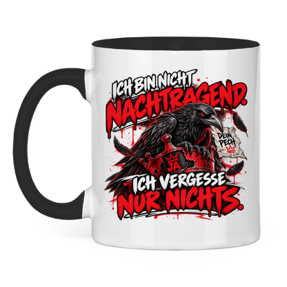 JA Ich vergesse nichts – Tasse in Schwarz, Vorderansicht, Aufdruck: Rabe auf roter Krone: „Ich bin nicht nachtragend. Ich vergesse nur nichts.“
