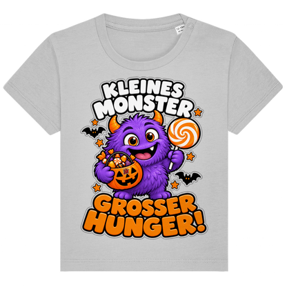 JA Naschmonster – Baby-T-Shirt in Grau meliert, Vorderansicht, Frontdruck: Lila Naschmonster mit Lolli: „Kleines Monster. Großer Hunger!“