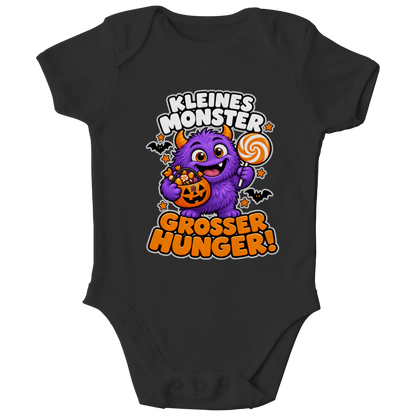 JA Naschmonster – Baby-Body in Schwarz, Vorderansicht, Frontdruck: Lila Naschmonster mit Lolli: „Kleines Monster. Großer Hunger!“