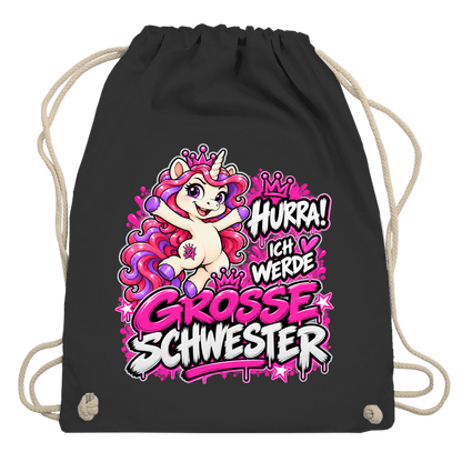 JA Große Schwester Einhorn – Turnbeutel in Schwarz, Aufdruck: Einhorn Juna: „Hurra! Ich werde große Schwester“ – Geschenk zur Baby-Ankündigung