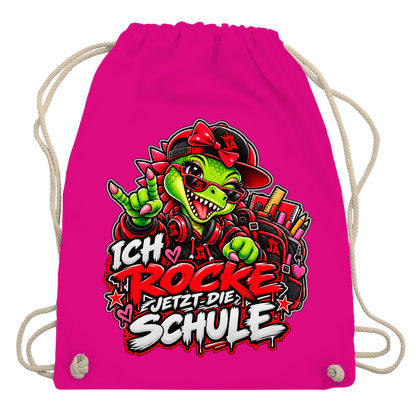JA Schulstart Dino Mädchen – Turnbeutel in Fuchsia, Aufdruck: Dino-Mädchen mit Schulsachen: „Ich rocke jetzt die Schule“ zur Einschulung