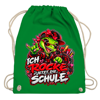JA Schulstart Dino Mädchen – Turnbeutel in Kellygrün, Aufdruck: Dino-Mädchen mit Schulsachen: „Ich rocke jetzt die Schule“ zur Einschulung