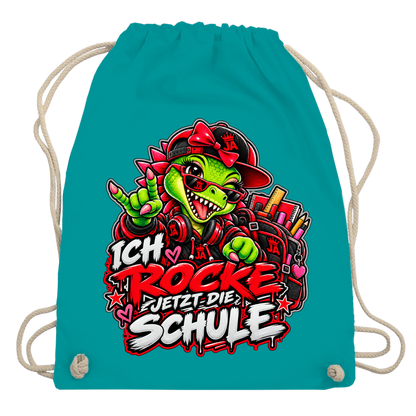 JA Schulstart Dino Mädchen – Turnbeutel in Smaragdgrün, Aufdruck: Dino-Mädchen mit Schulsachen: „Ich rocke jetzt die Schule“ zur Einschulung