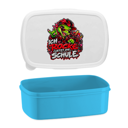 JA Schulstart Dino Mädchen – Lunchbox in Blau, Aufdruck: Dino-Mädchen mit Schulsachen: „Ich rocke jetzt die Schule“ zur Einschulung