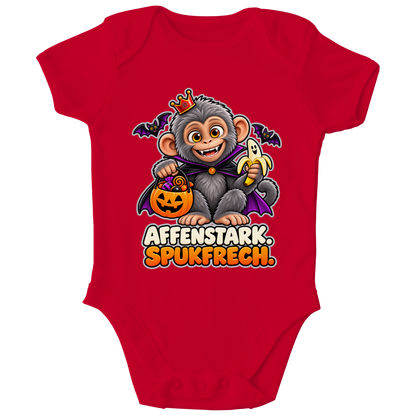 JA Spukaffe – Baby-Body in Rot, Vorderansicht, Frontdruck: Kleiner Affe im Vampirumhang: „Affenstark. Spukfrech.“ – Kinder-Halloween