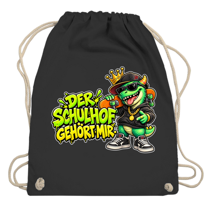 JA Pausenboss – Turnbeutel in Schwarz, Aufdruck: Skater-Dino mit Krone: „Der Schulhof gehört mir“ in Neongrün