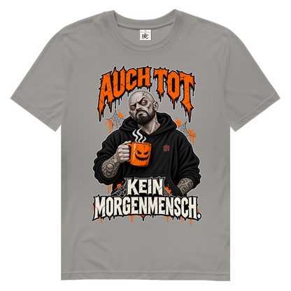 JA Morgenmuffel – Herren-Bio-T-Shirt in Hellgrau, Vorderansicht, Frontdruck: Müder Zombie mit Kaffeetasse: „Auch tot. Kein Morgenmensch.“