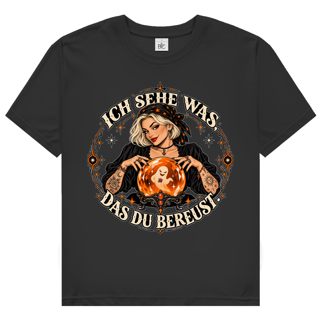 JA Orakel – Damen-T-Shirt in Schwarz, Vorderansicht, Frontdruck: Wahrsagerin mit Kristallkugel und Spruch „Ich sehe was, das du bereust“