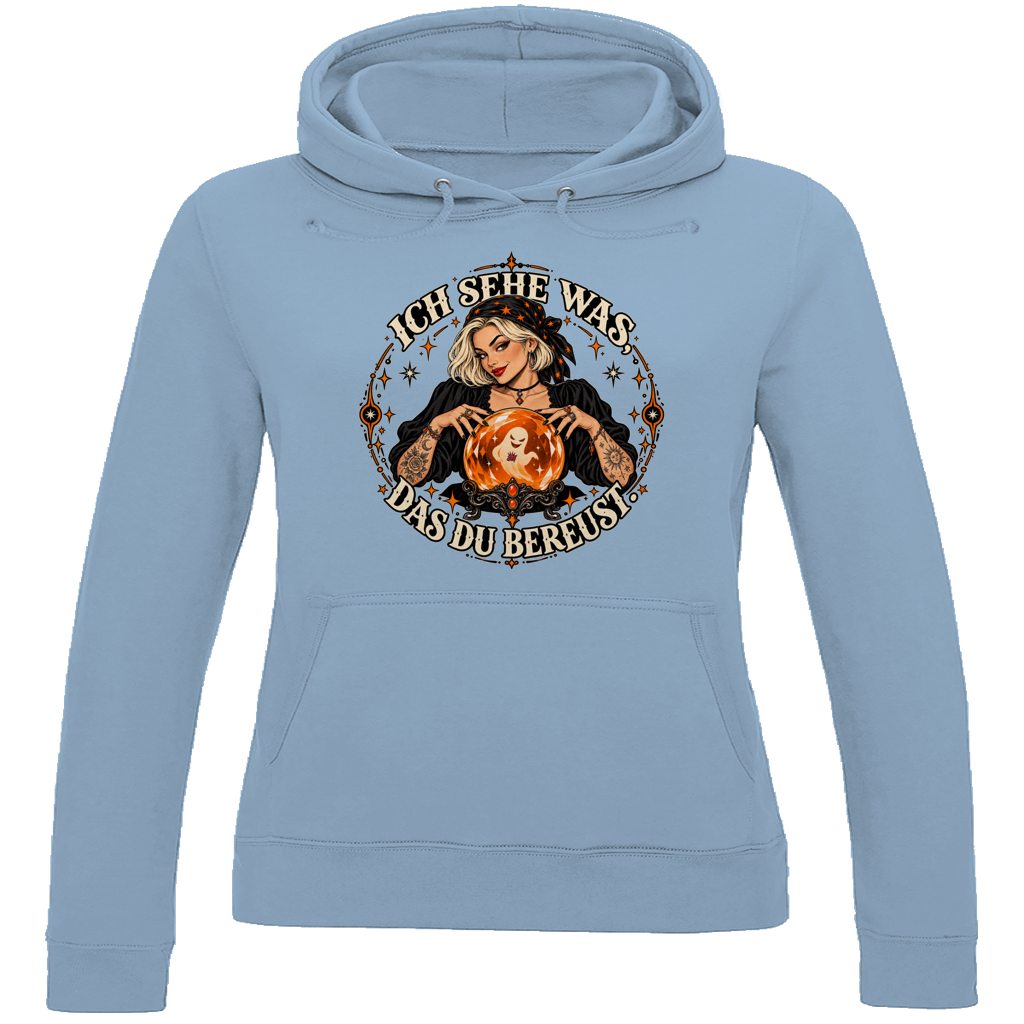 JA Orakel – Damen-Hoodie in Himmelblau, Vorderansicht, Frontdruck: Wahrsagerin mit Kristallkugel und Spruch „Ich sehe was, das du bereust“