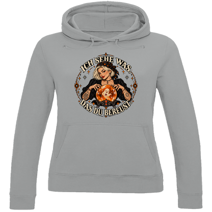 JA Orakel – Damen-Hoodie in Grau meliert, Vorderansicht, Frontdruck: Wahrsagerin mit Kristallkugel und Spruch „Ich sehe was, das du bereust“