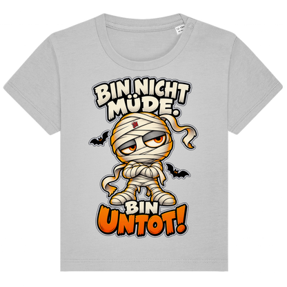 JA Untotfrech – Baby-T-Shirt in Grau meliert, Vorderansicht, Frontdruck: Niedliche Mumie: „Bin nicht müde. Bin untot!“ – Halloween für kleine Nachteulen