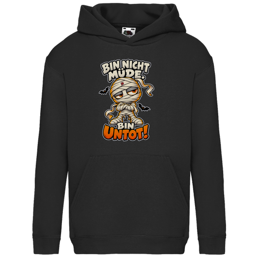 JA Untotfrech – Kinder-Hoodie in Schwarz, Vorderansicht, Frontdruck: Niedliche Mumie: „Bin nicht müde. Bin untot!“ – Halloween für kleine Nachteulen
