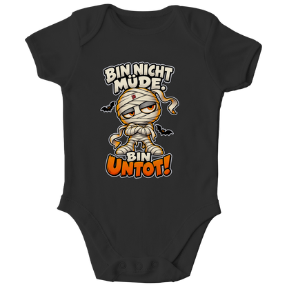 JA Untotfrech – Baby-Body in Schwarz, Vorderansicht, Frontdruck: Niedliche Mumie: „Bin nicht müde. Bin untot!“ – Halloween für kleine Nachteulen