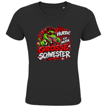JA Große Schwester Dino – Kinder-T-Shirt in Schwarz, Vorderansicht, Frontdruck: Dino-Motiv „Hurra! Ich werde große Schwester“ – Geschenk zur Geschwister-Ankündigung