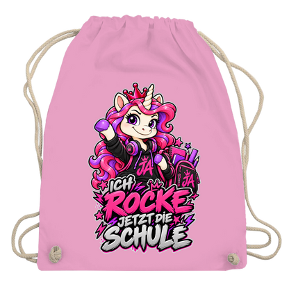 JA Schulstart Einhorn – Turnbeutel in Rosa, Aufdruck: Einhorn mit Schulsachen: „Ich rocke jetzt die Schule“ – Geschenk zur Einschulung