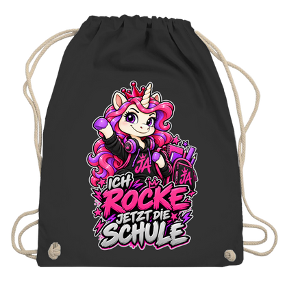 JA Schulstart Einhorn – Turnbeutel in Schwarz, Aufdruck: Einhorn mit Schulsachen: „Ich rocke jetzt die Schule“ – Geschenk zur Einschulung